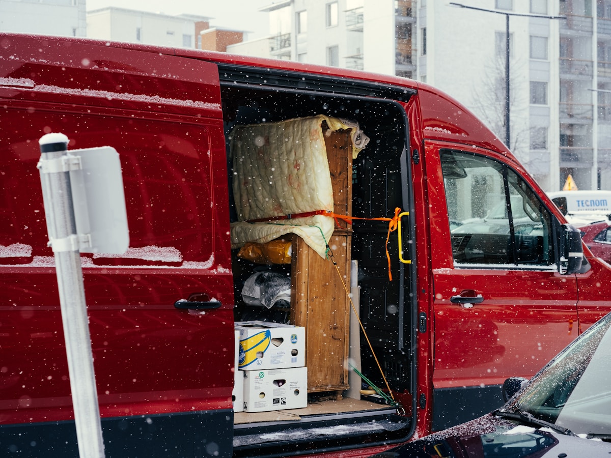 Red moving van on a city street